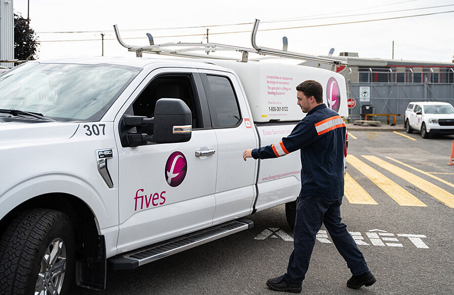 Employee walking toward a company service vehicle