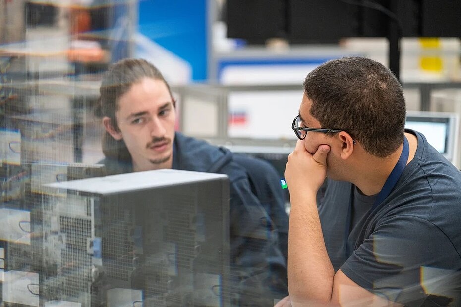 Mounir and Raphaël at work